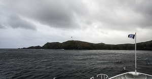 Cape Horn. The flag and station are in the center. The monument is just to the right of that on the next hill.